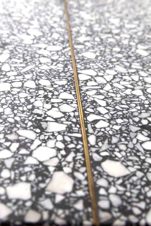 This Terrazzo tile sample from Carly Jo Morgan displays various elements from different materials.